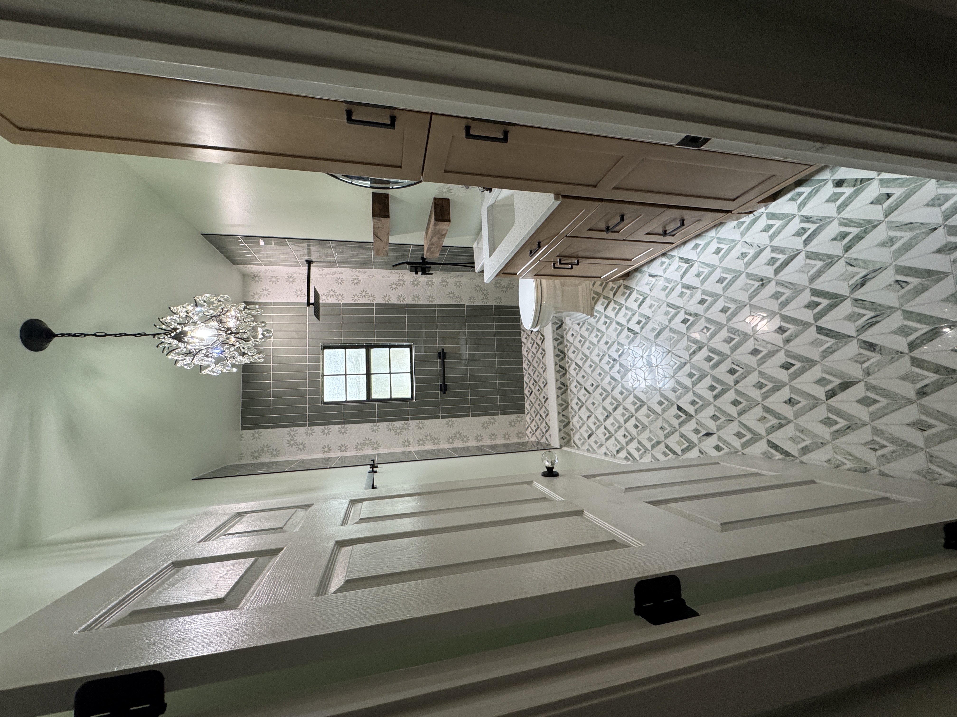 Bathroom remodeled with walk-in shower, custom tile, and refreshed cabinetry